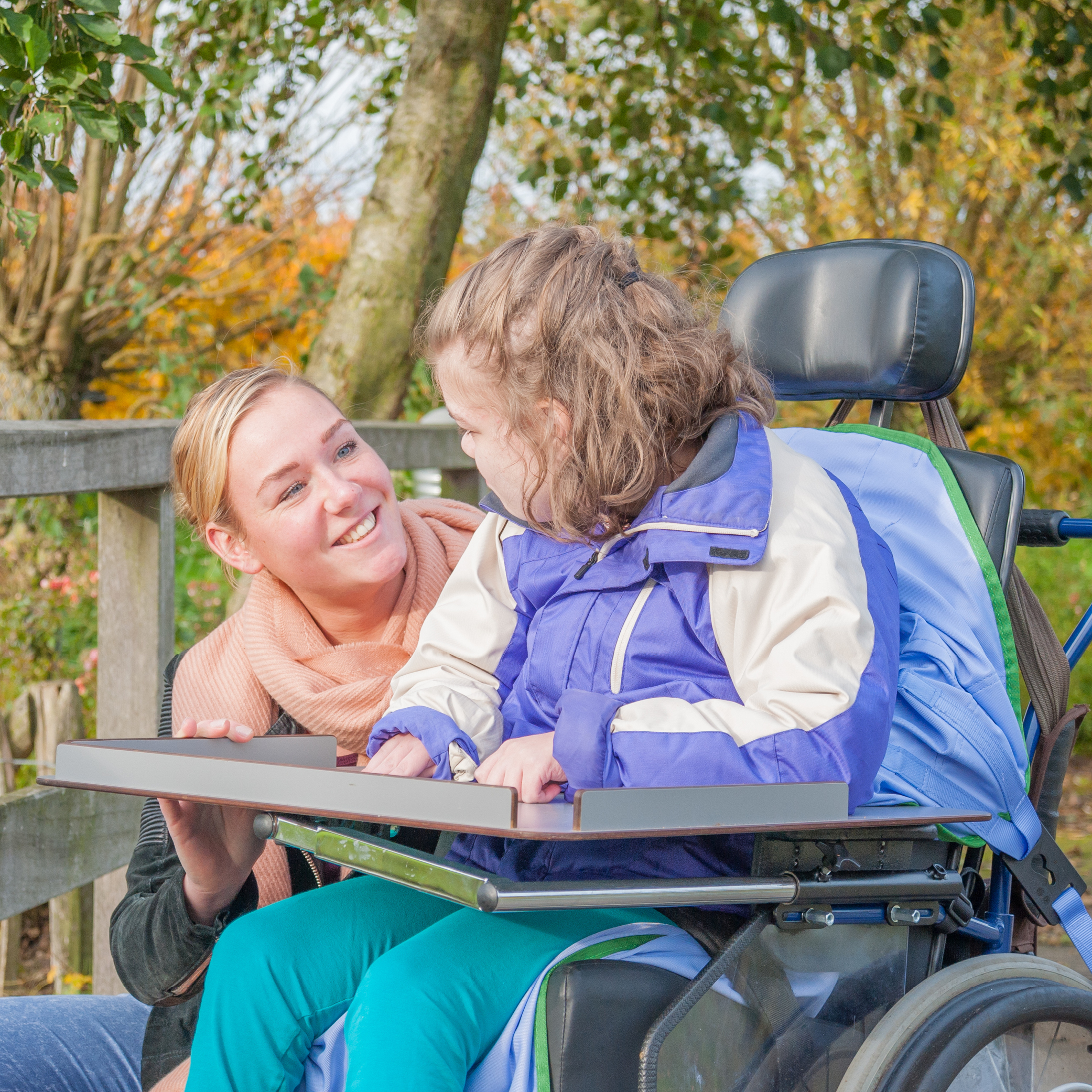 woman in wheelchair with her carer
