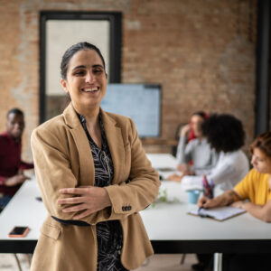 woman smiling in a team meeting