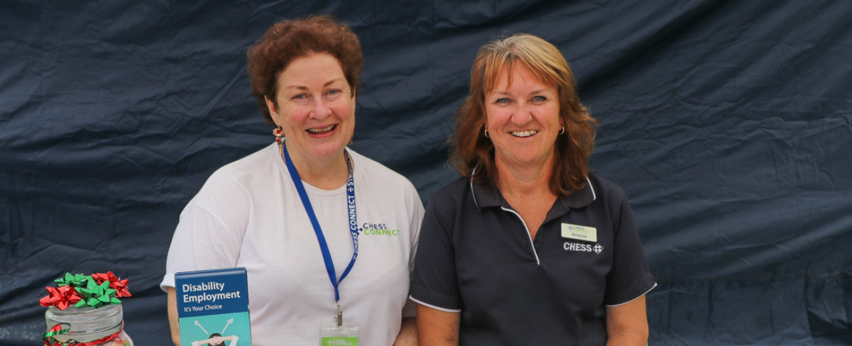 Candid photo of two CHESS Connect Staff members, smiling and looking into the camera